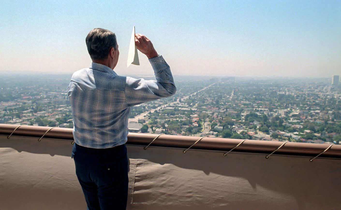President Reagan throwing a paper airplane