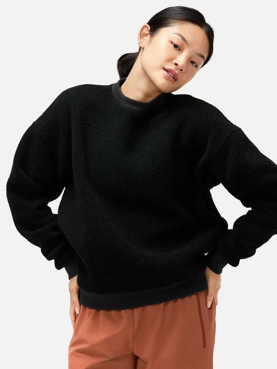 black fleece sweatshirt on model