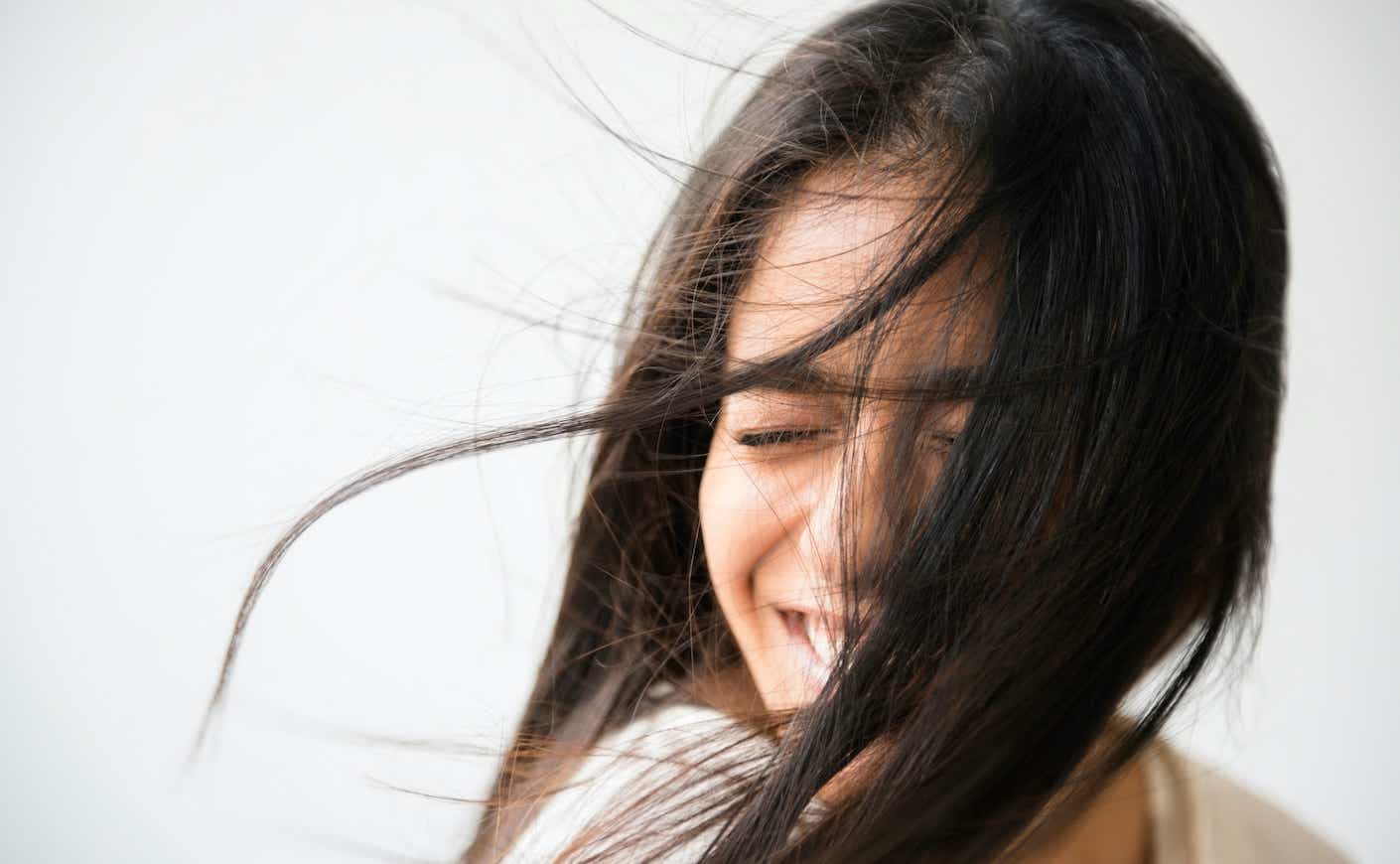 Hair of Indian woman blowing in wind
