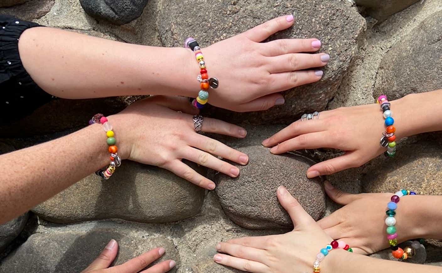 friends wearing beads bracelets