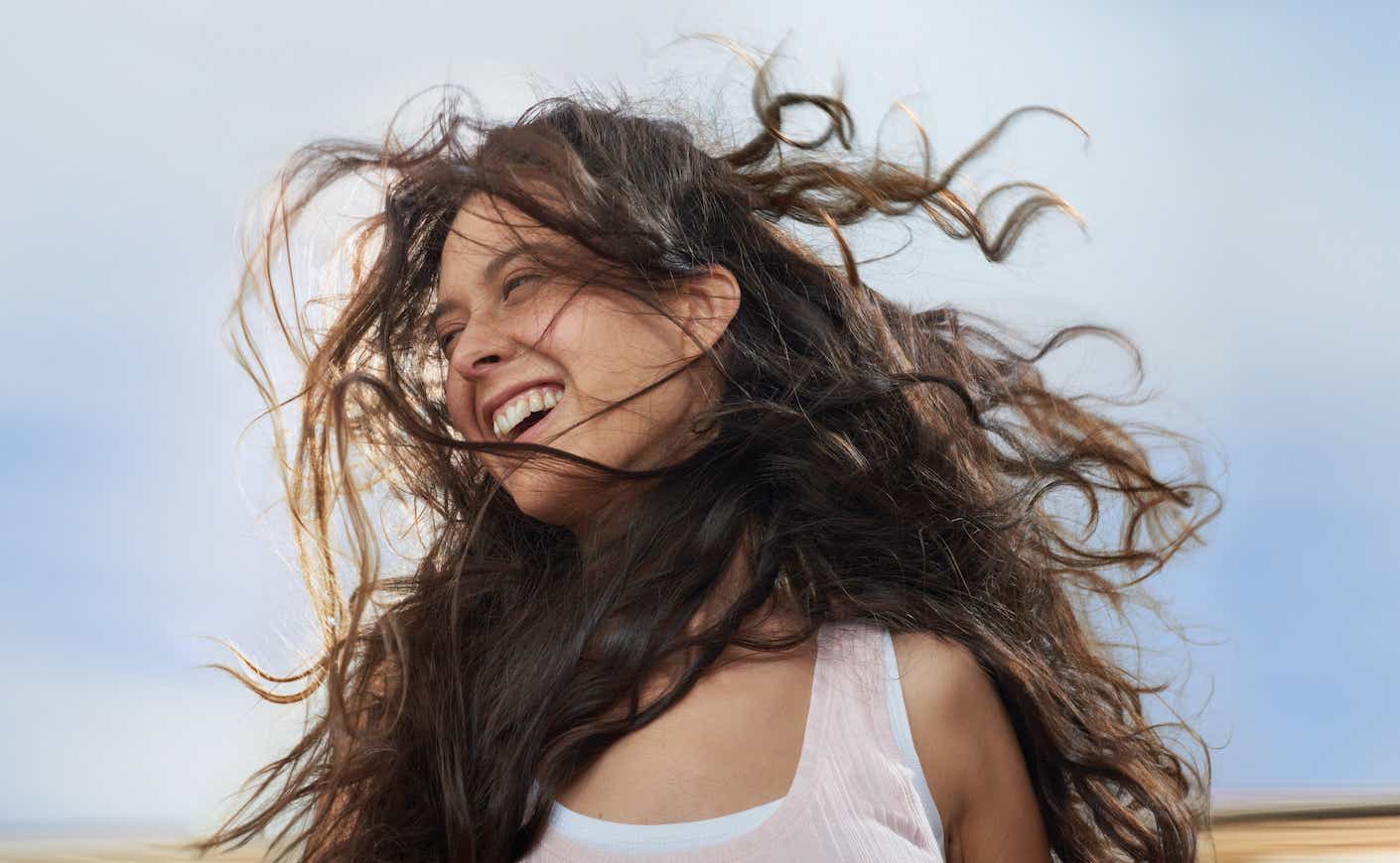 Girl enjoying wind in her hair while moving