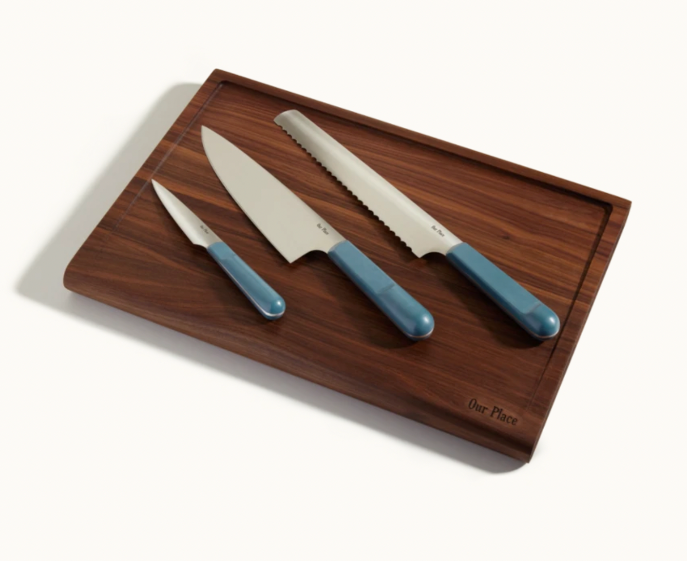 colorful knives on wood cutting board