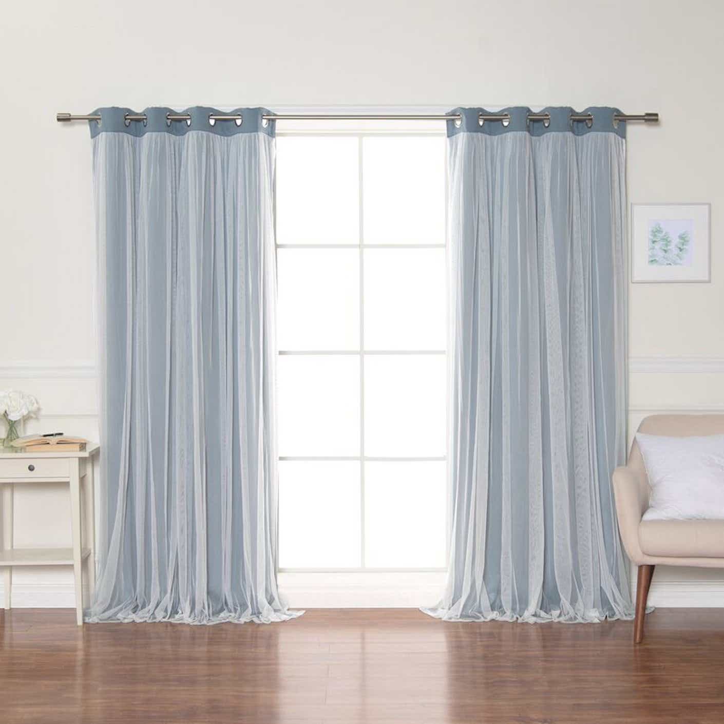 solid blackout grommet curtain panels in a living room with big window