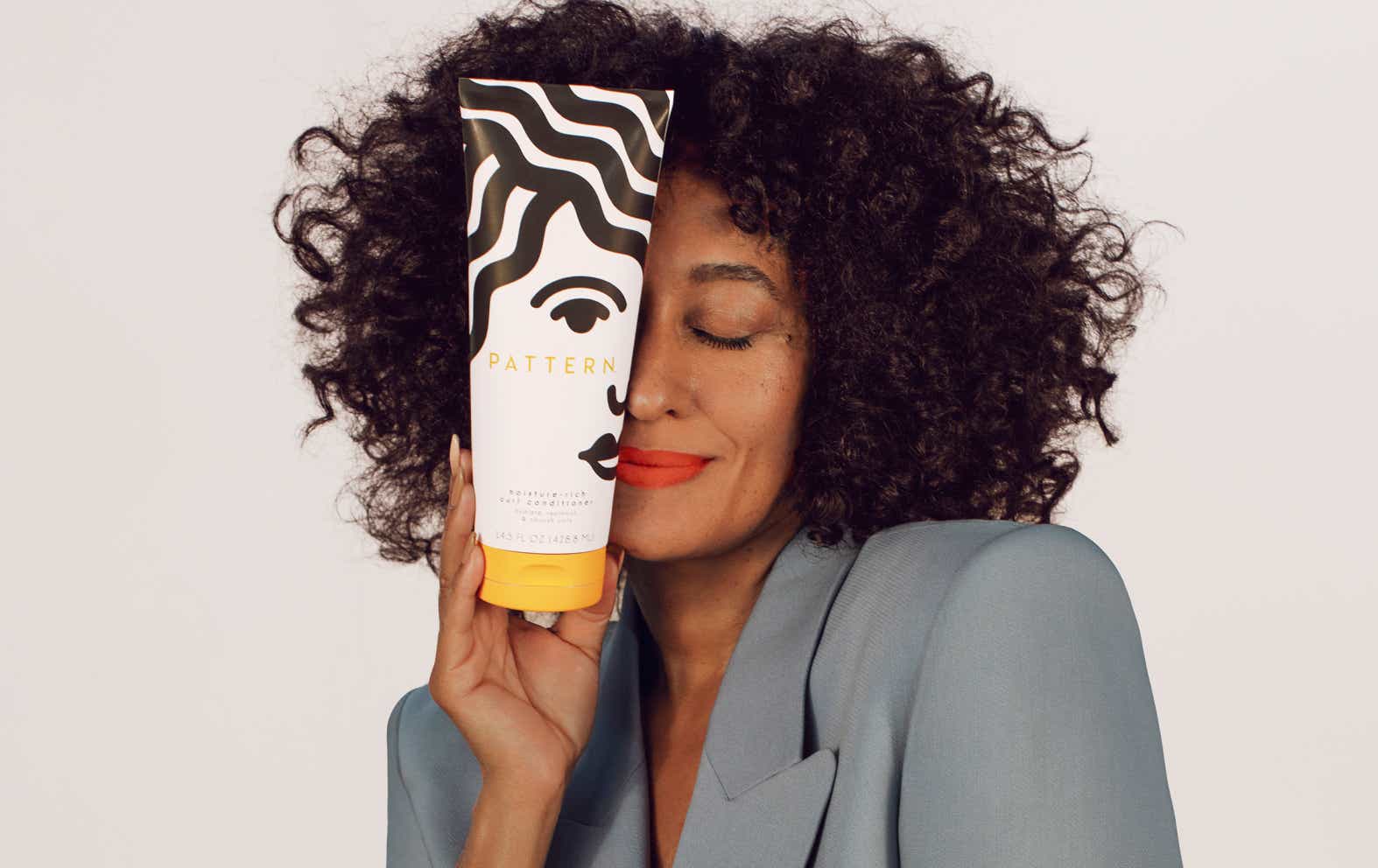 Tracee Ellis Ross holding Pattern Beauty product