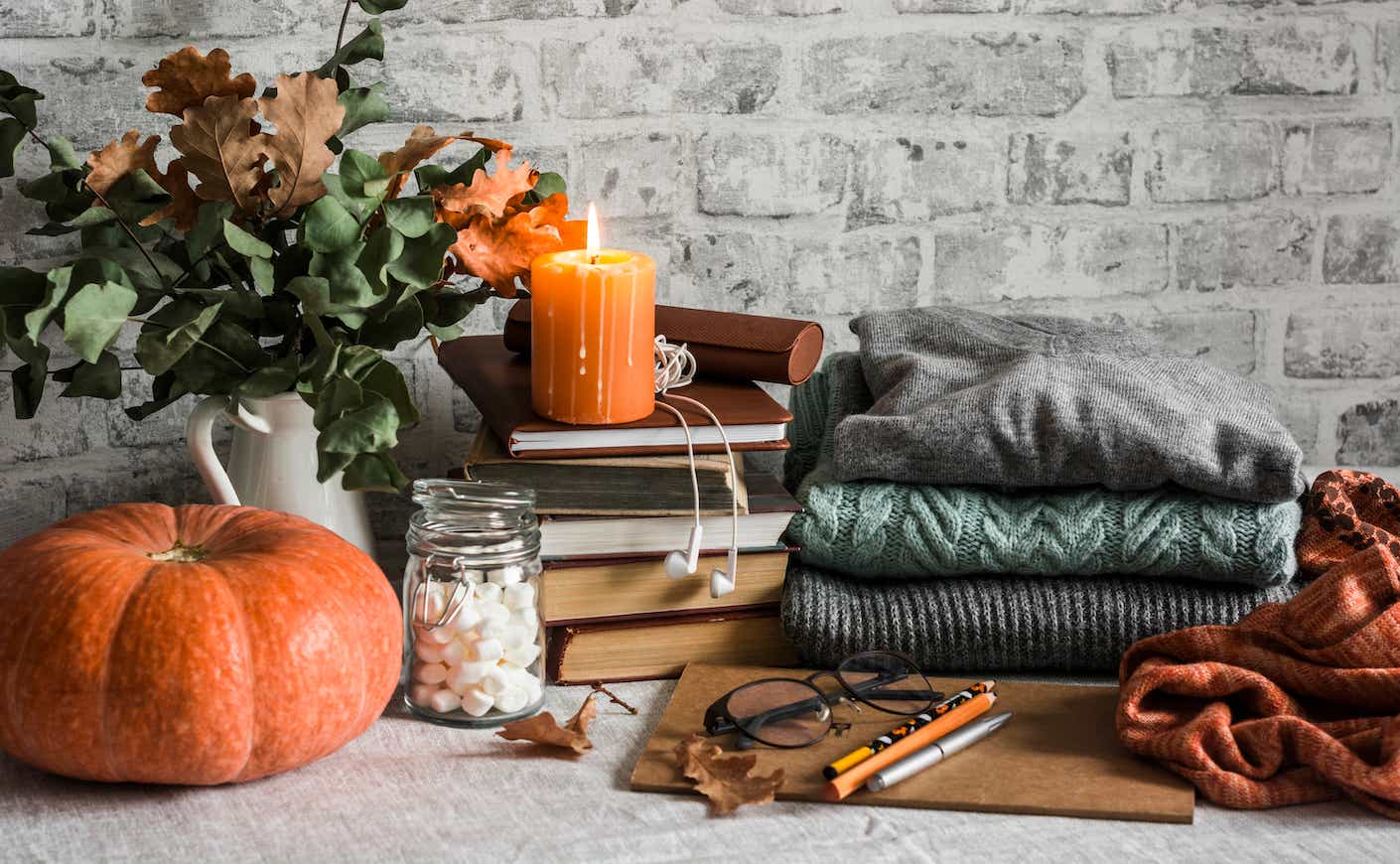 fall favorites including pumkin candles and cozy coats