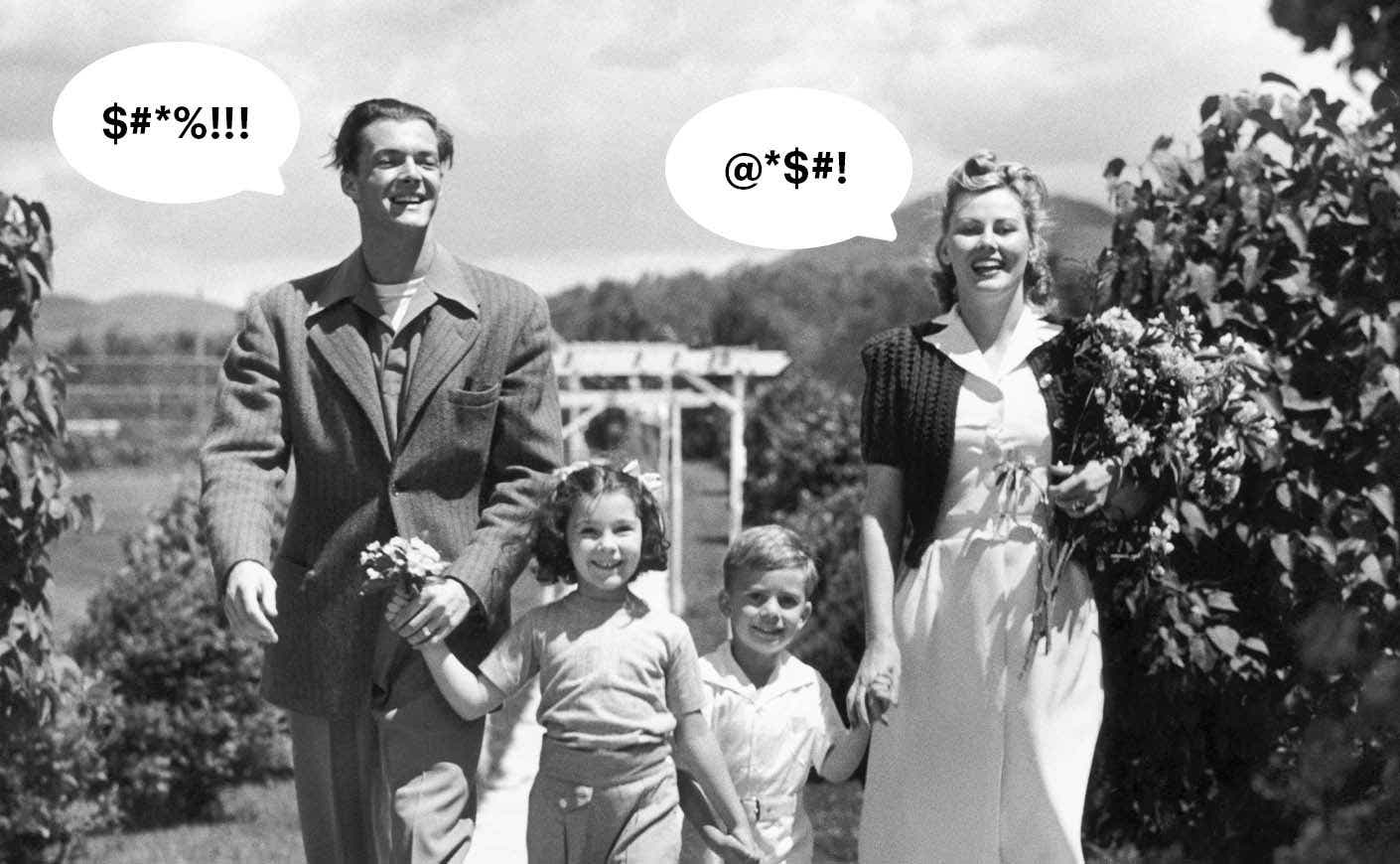 black and white picture of husband and wive with kids back in time