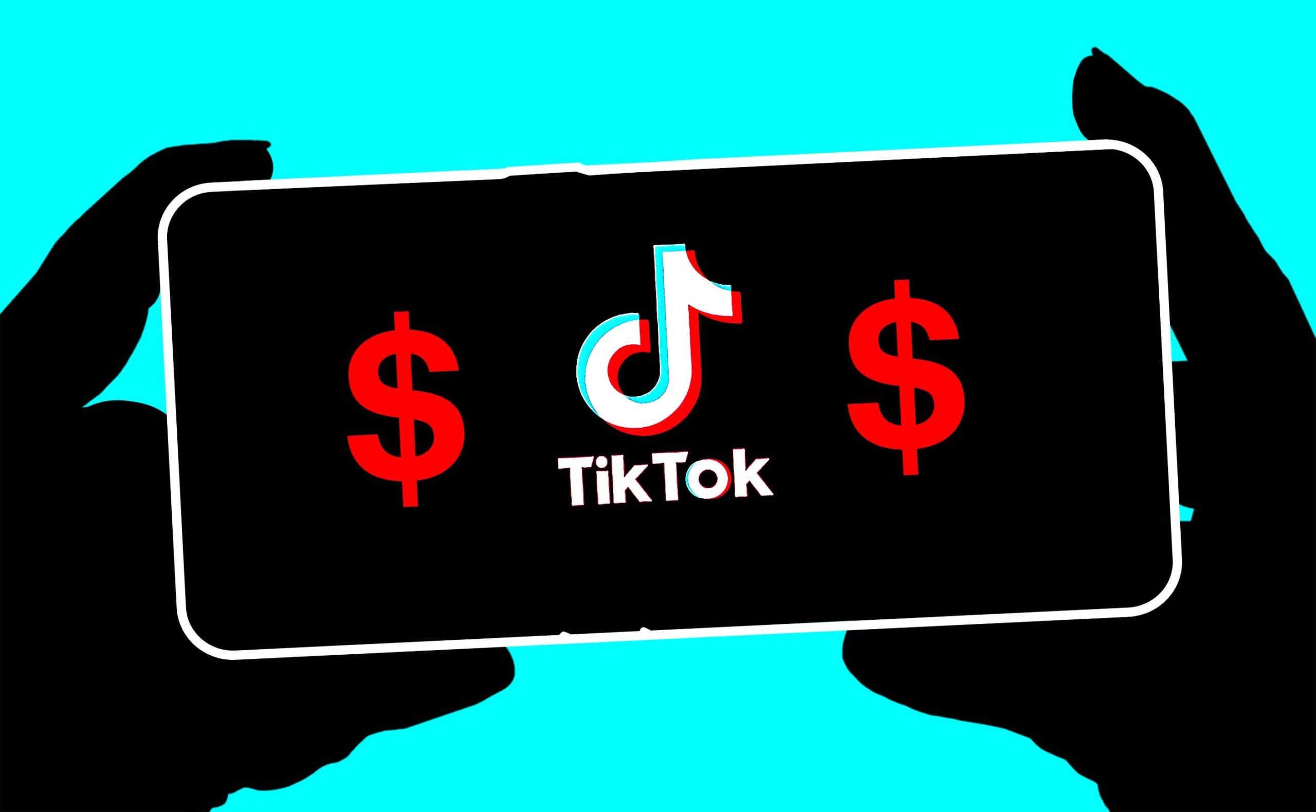 Hands holding a phone with the TikTok logo