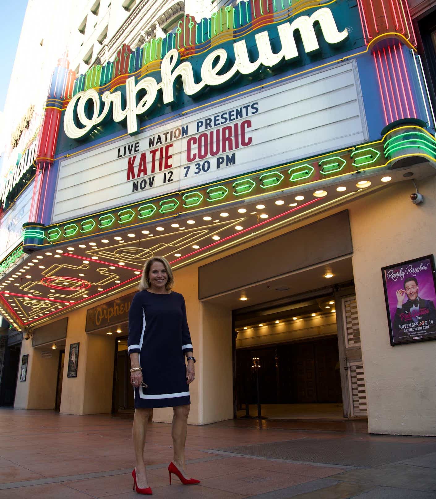 Katie Couric in front of the Orpheum Theater in Los Angeles in a navy blue dress