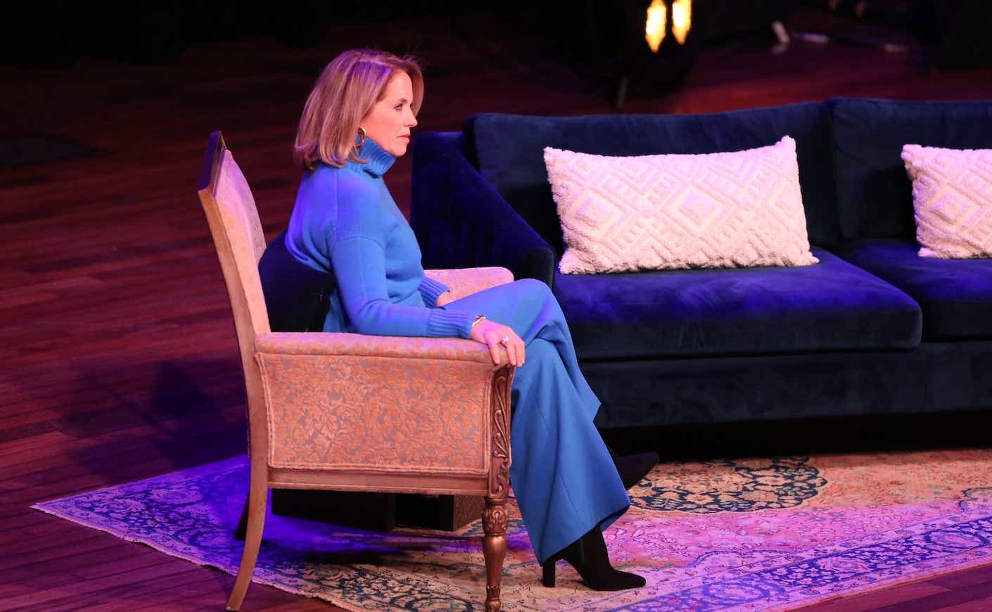 Katie Couric sitting while on tour