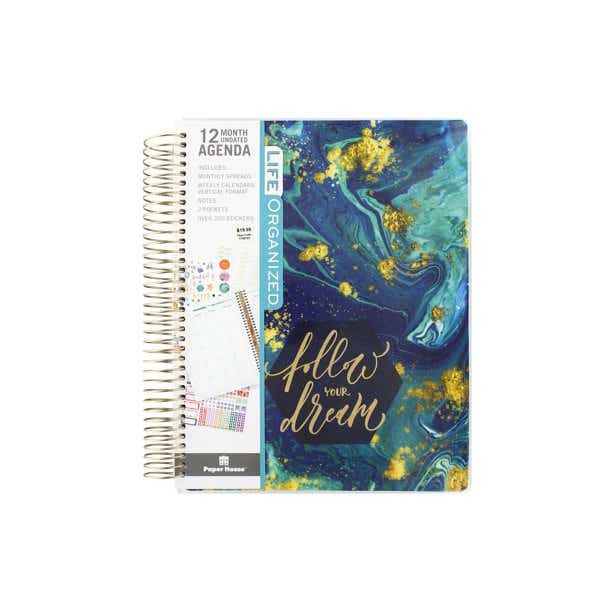 planner with abstract blue design that says follow your dream on the cover