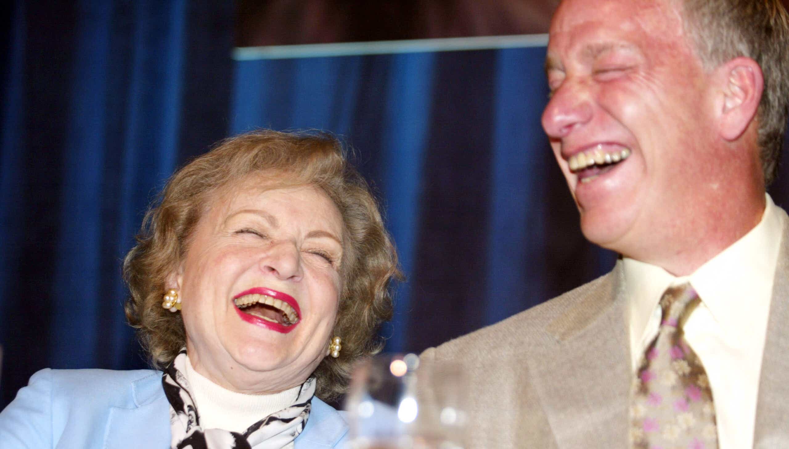 Actress Betty White and actor Tom Sullivan share a laugh during "Actors and Others for Animals" Roast of Betty White at the Universal Hilton on March 12, 2005
