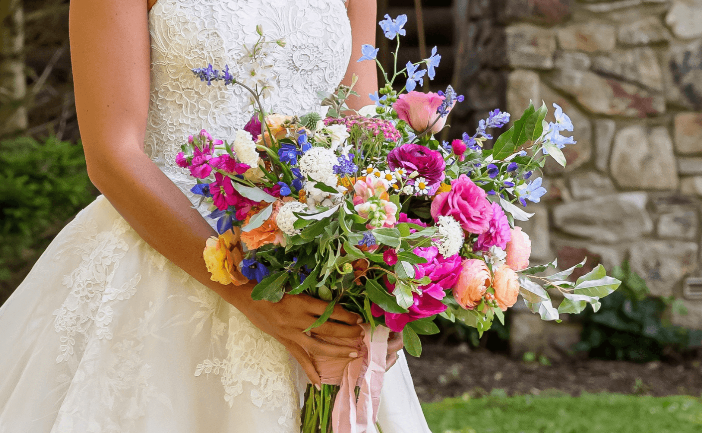 Ellie Monahan holding her bridal bouquet