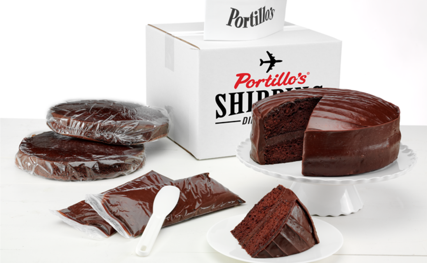 Portillo's chocolate cake with box and utensils