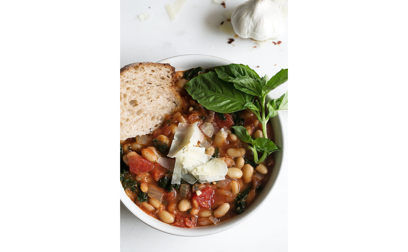 white bean kale tomato soup cooking with cocktail rings