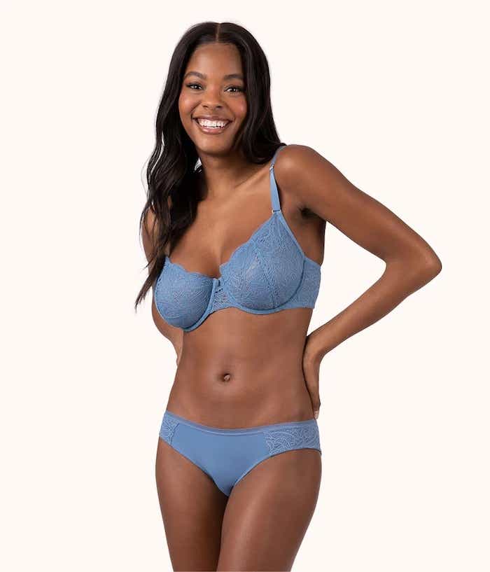 woman wearing blue lace bra and matching underwear