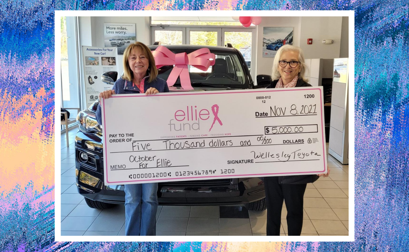 Nancy Wright accepts a donation for cancer charity The Ellie Fund