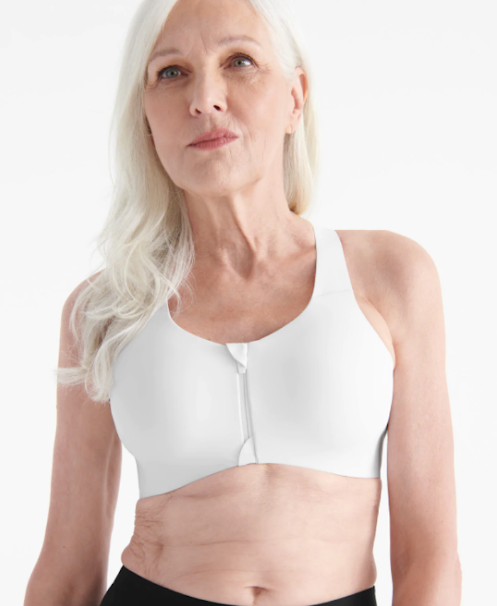 woman wearing zip-front white sports bra