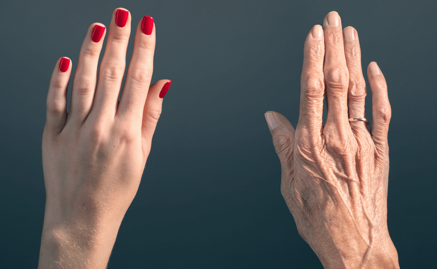 younger woman's hand and older hand