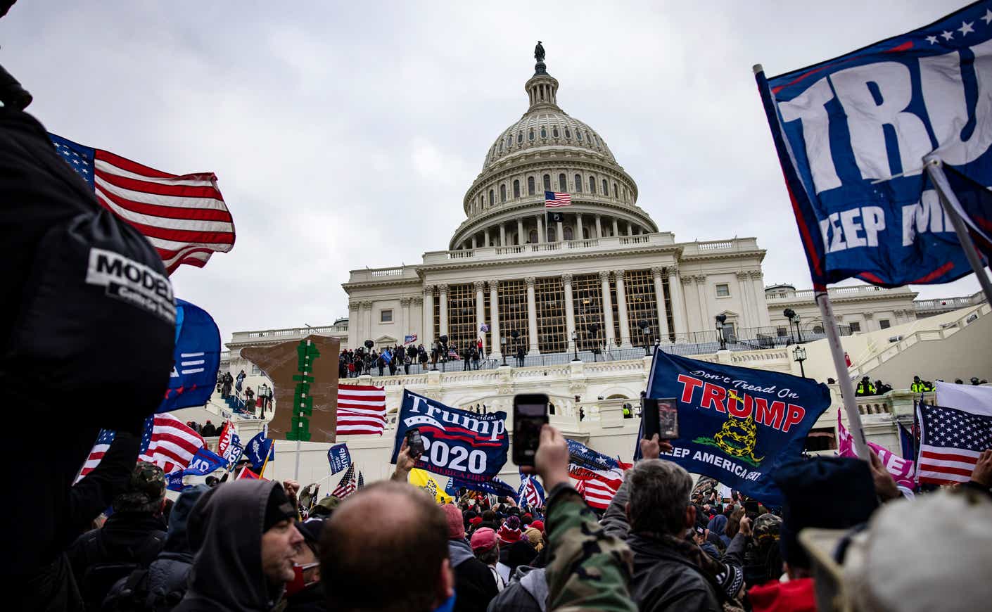 rioters gather outside of the U.S. Capitol