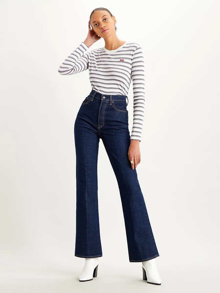 model wearing flared jeans