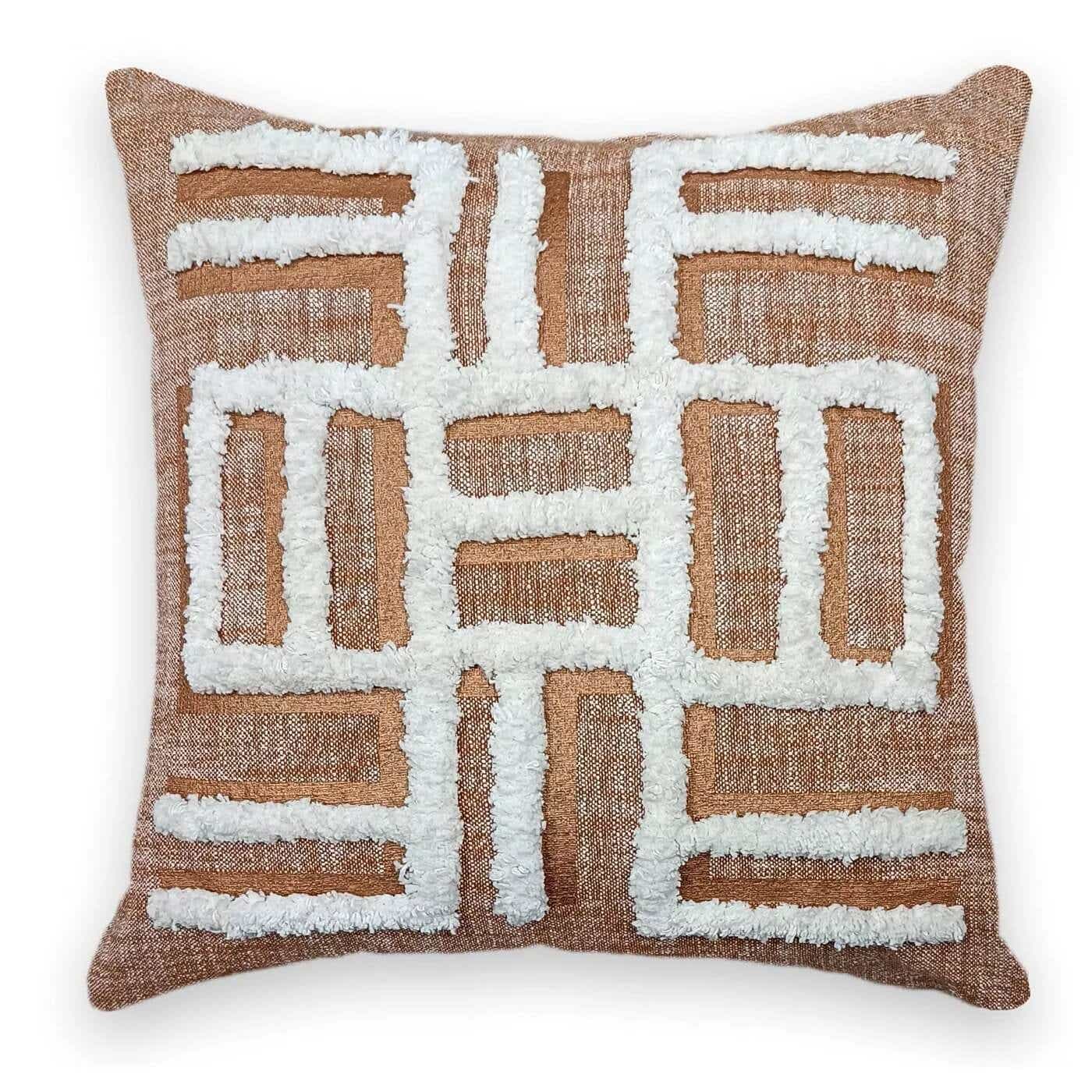 brown pillow with white tufted pattern