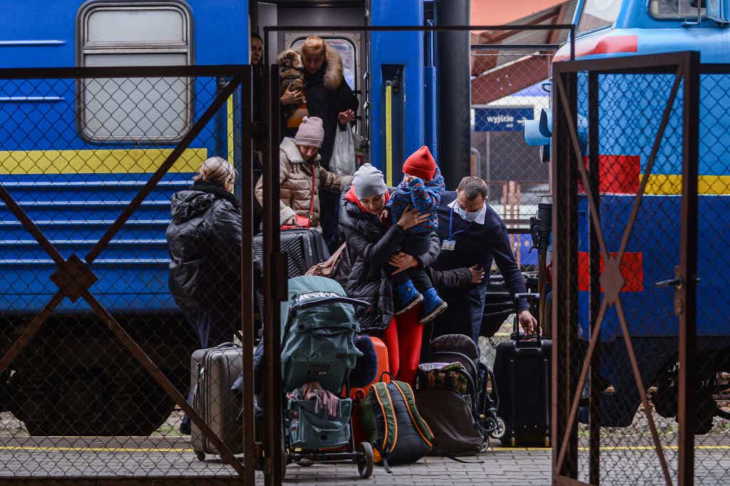 Ukrainian refugees exit a train in Poland