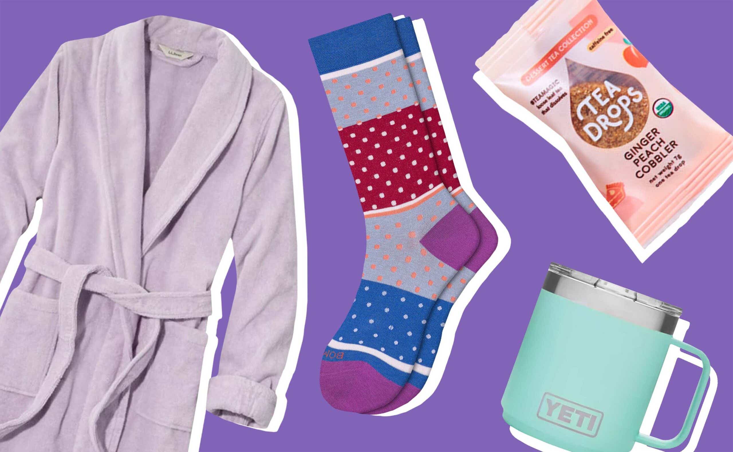 robe, socks, tea, and mug on purple background