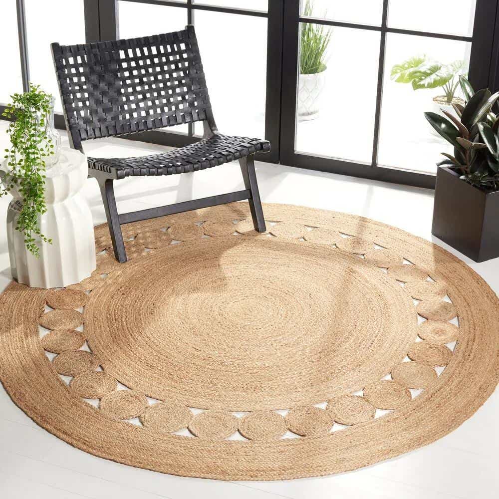 round rug with black chair on top