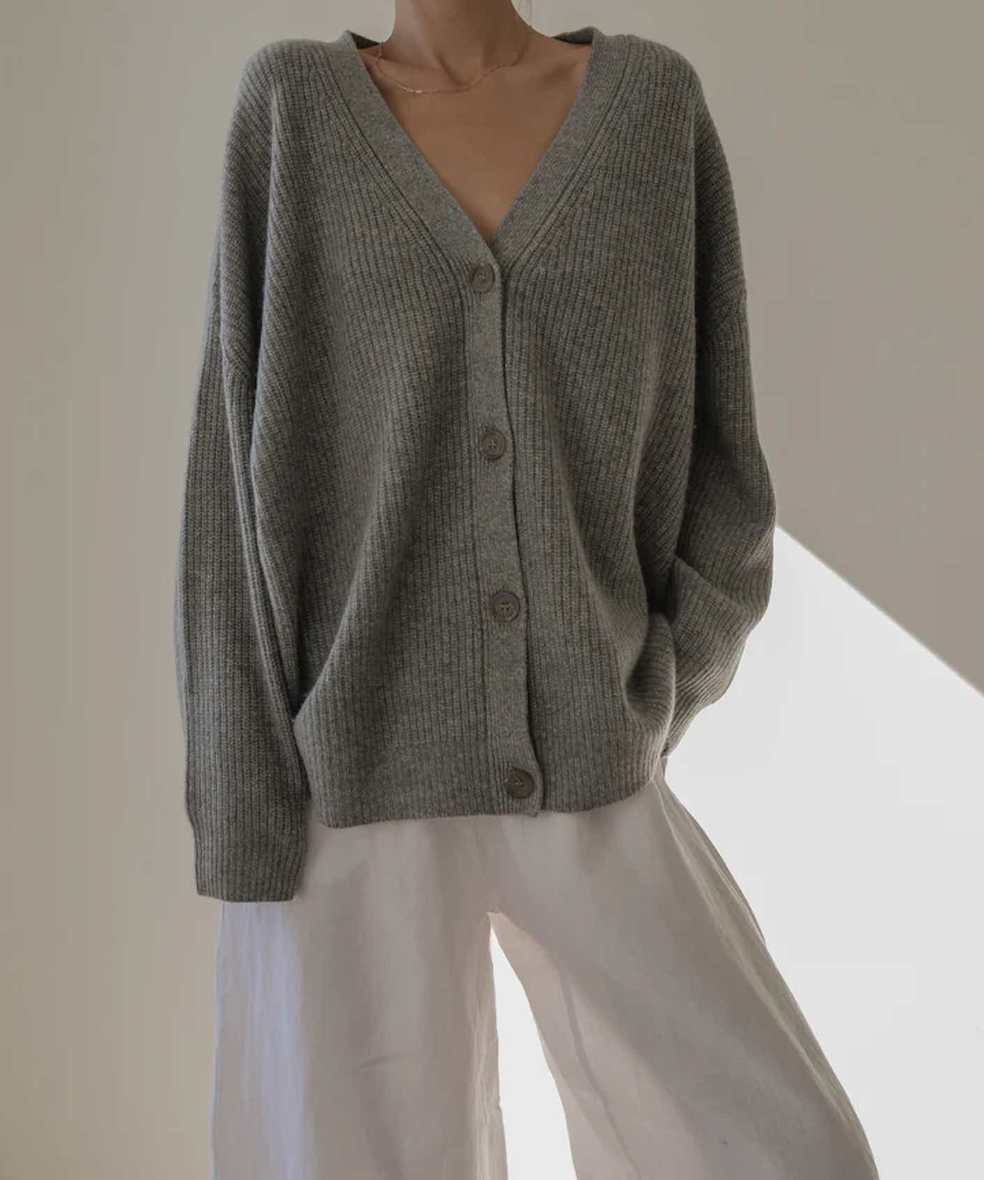 A woman poses in a slouchy cashmere caradigan.