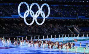 Athletes parade through the Olympic stadium at the 2022 Winter Games.