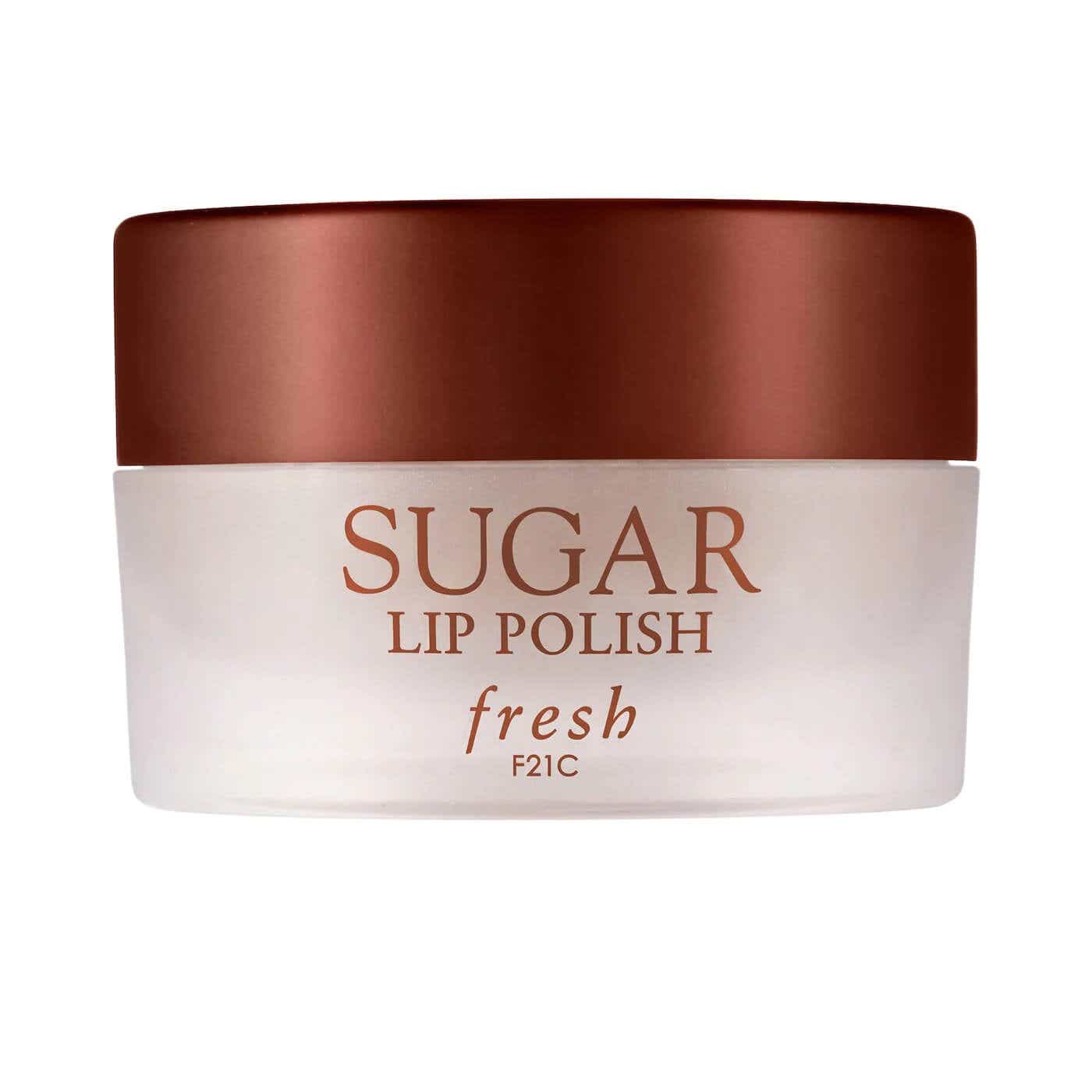 sugar lip polish in clear jar on white background