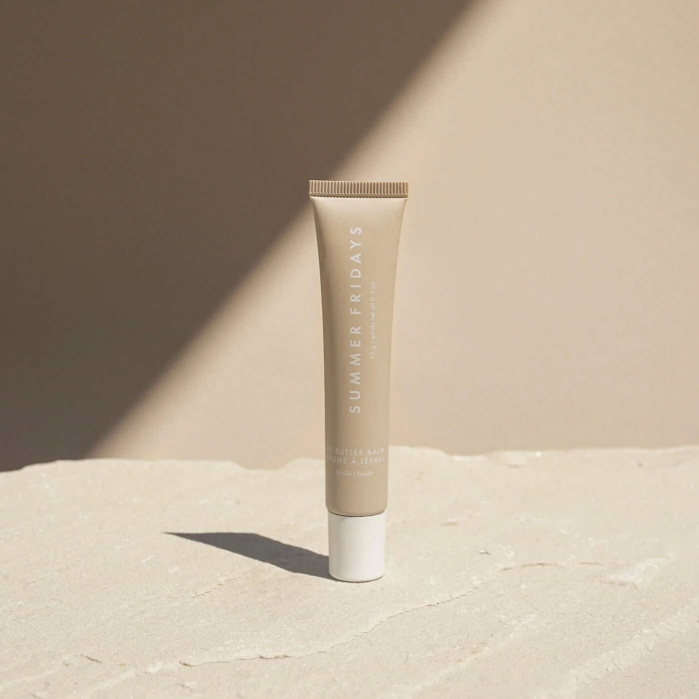 summer friday lip balm on beige background