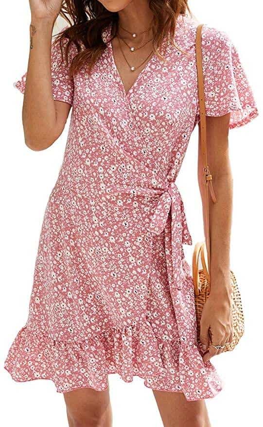 model wearing pink floral wrap dress