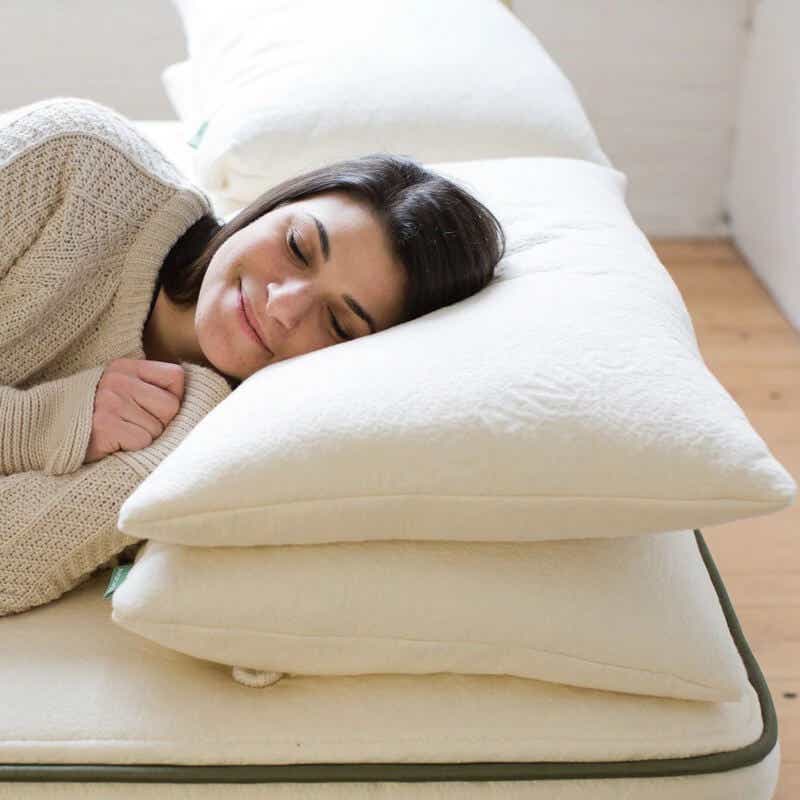model sleeping on avocado green pillow