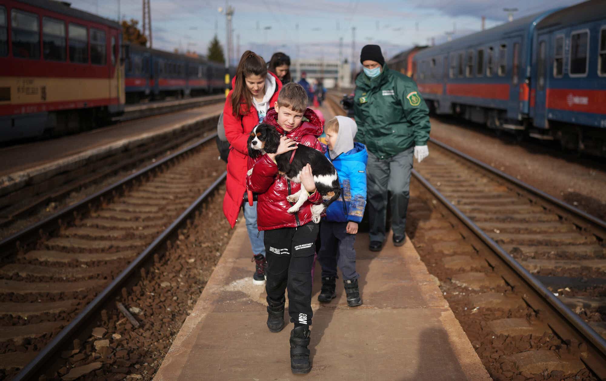 Ukrainians Flee To Hungary Amid Russia's Armed Invasion