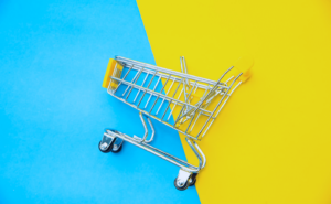 shopping cart on blue and yellow background