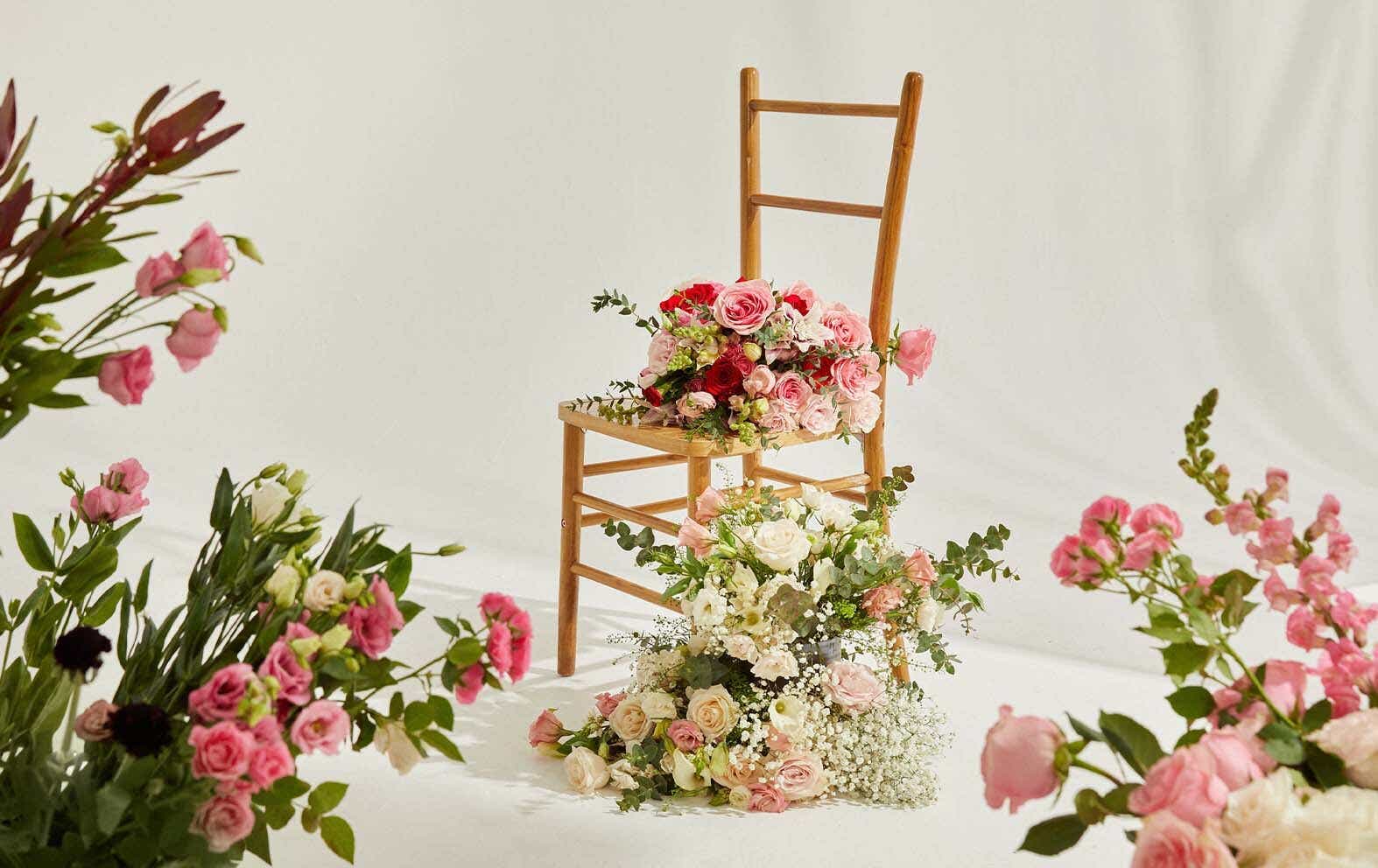 Bouquets of flowers surrounding a chair