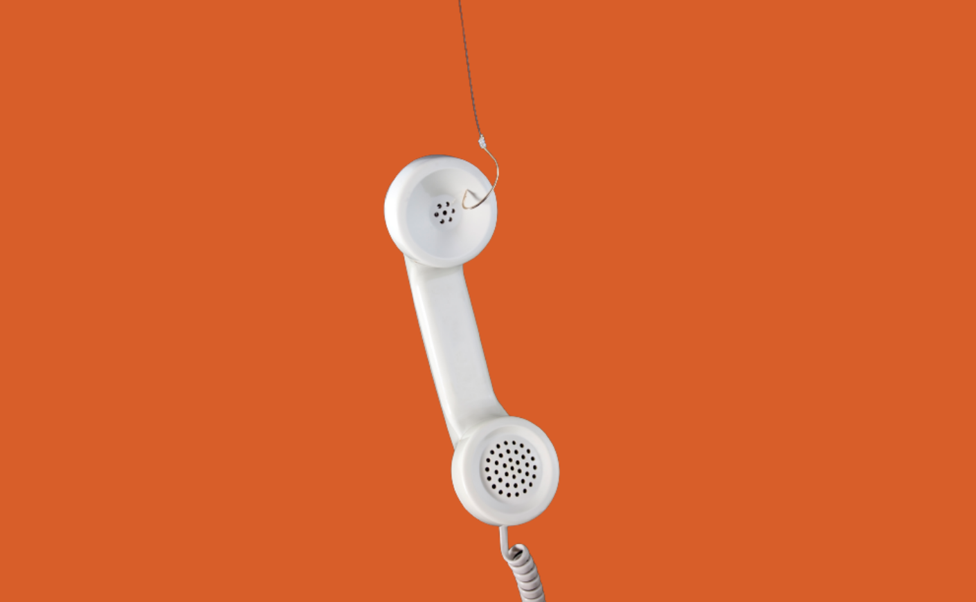 phone with a fish hook on orange background