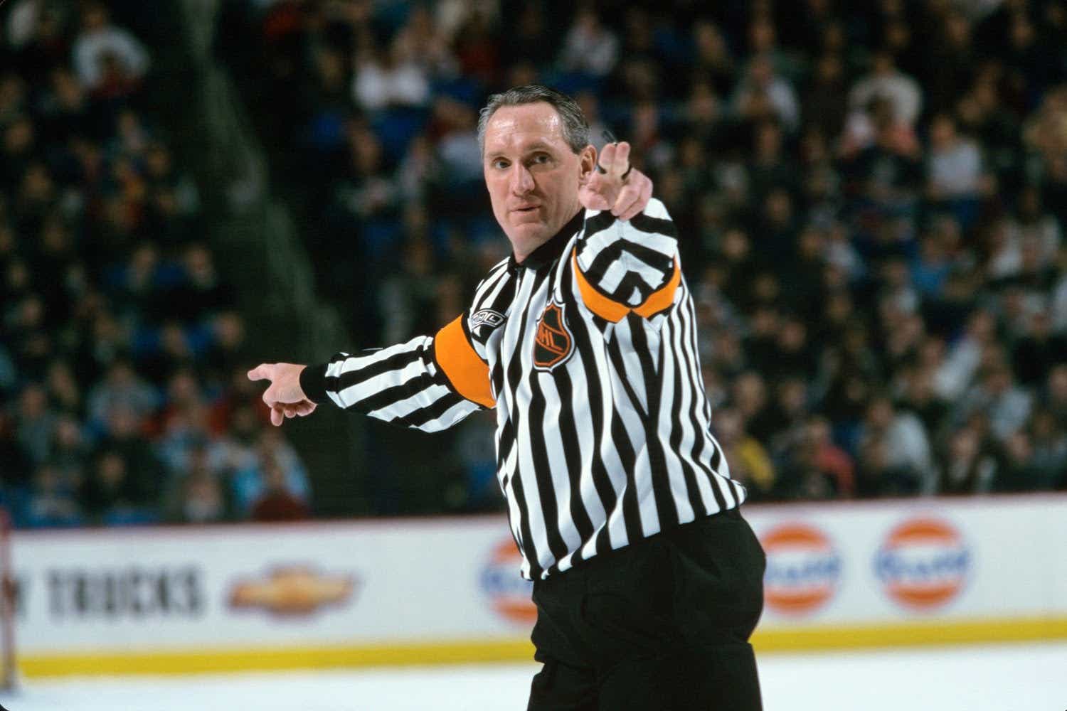 Hockey referee Paul Stewart on the ice during a game