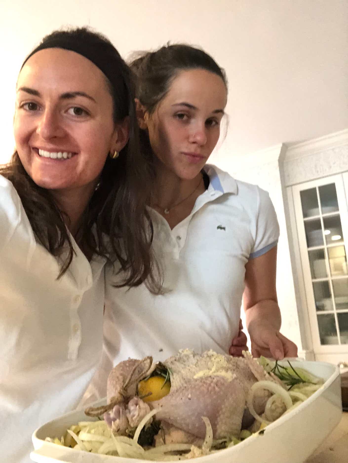 Katie Couric's daughter and assistant in white with a chicken for Katie