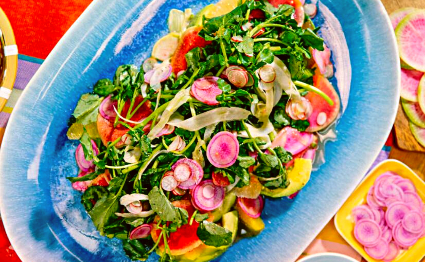 salad with radishes on a blue plate