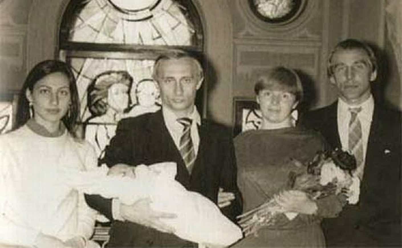 Young Vladimir Putin with his wife Lyudmila and daughter