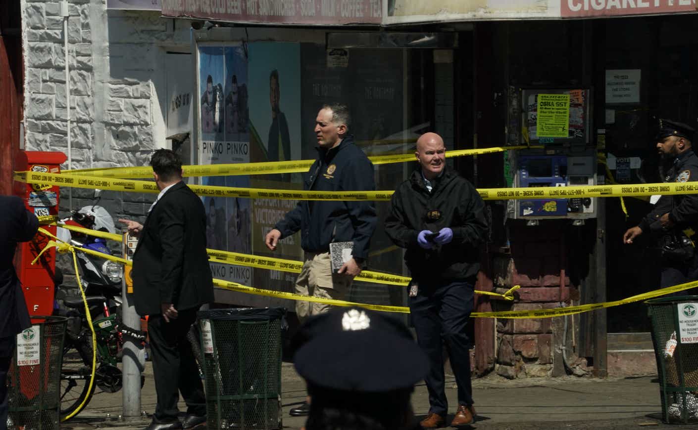 police officers outside the site of a mass shooting in Brooklyn