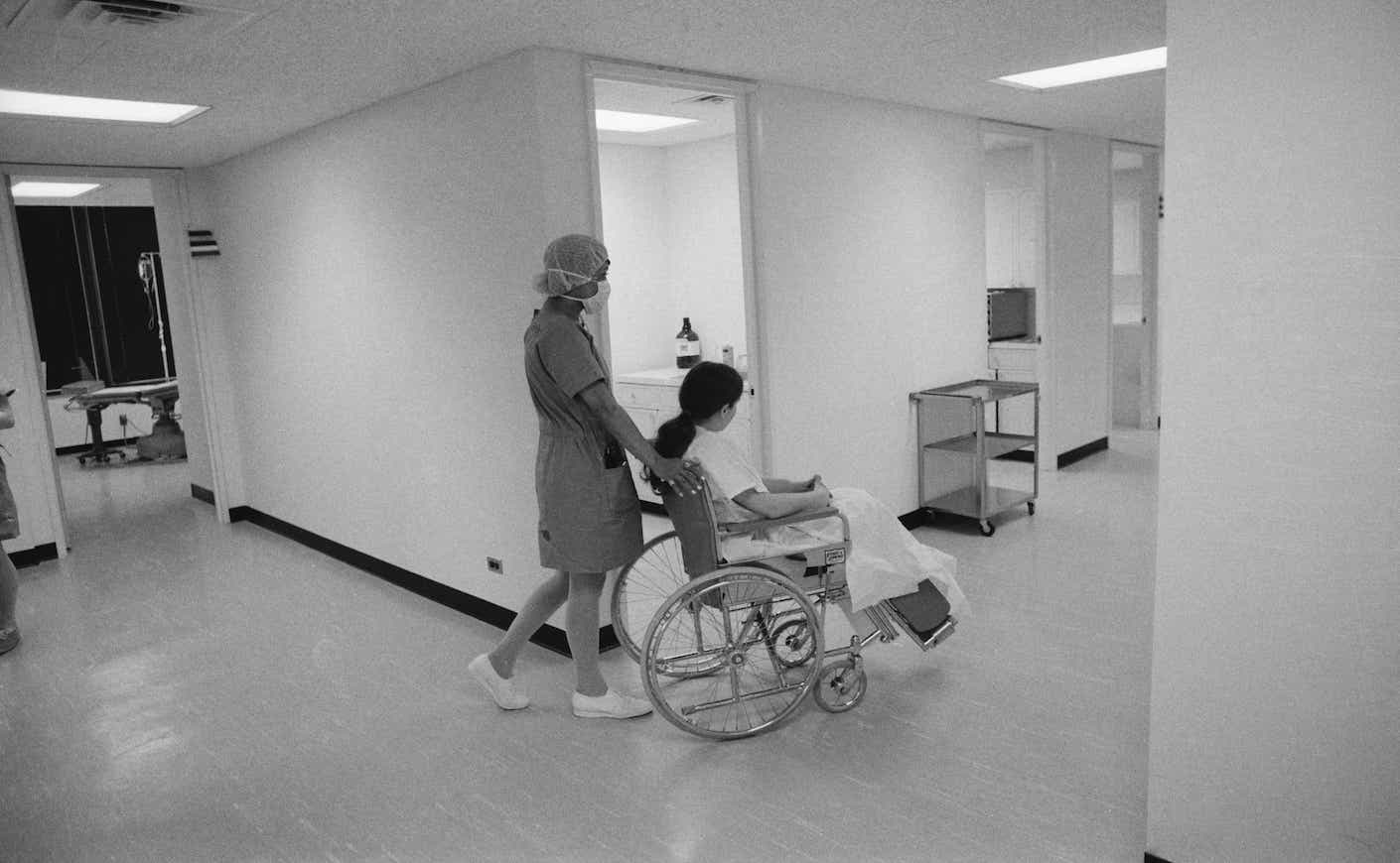 A patient is wheeled from the operating room to the recovery room at PARKMED, the new abortion center in 1971
