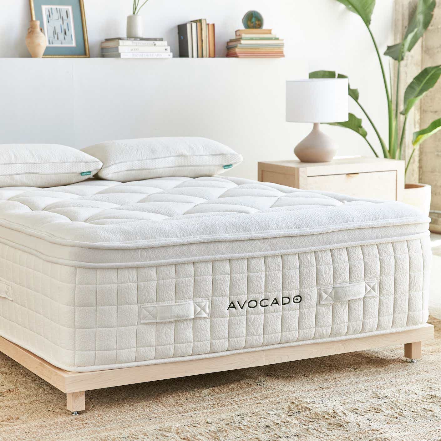 An Avocado mattress on a white bed.