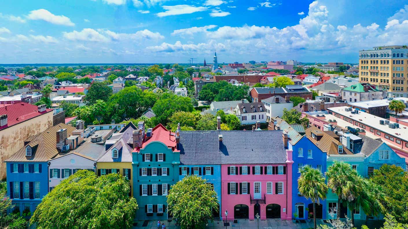 An aerial photo of "Rainbow Row" — a row of brightly colored homes in Charleston, South Carolina.