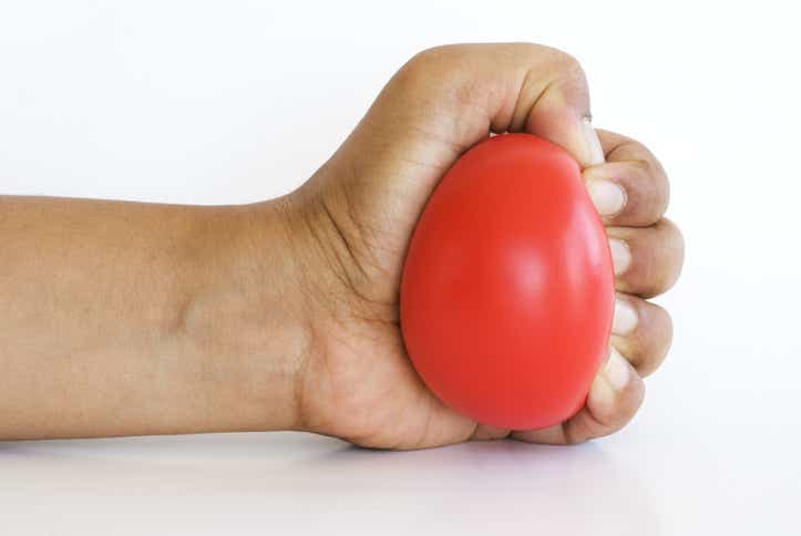 hand squeezing stress ball