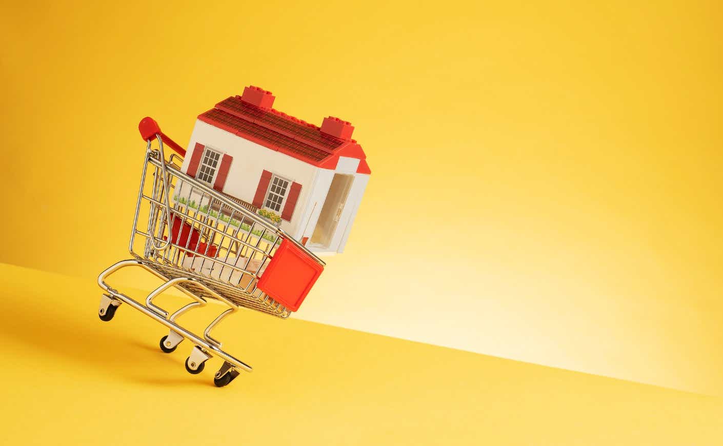 Illustration of a shopping cart with a house inside