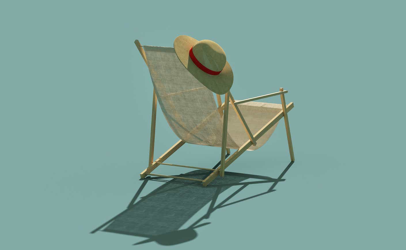 a beach chair with a hat hanging off it