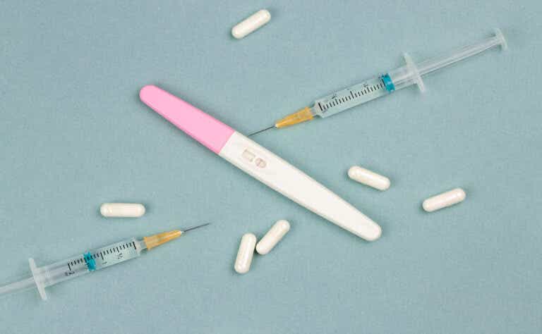 a negative pregnancy test with needles and pills around it